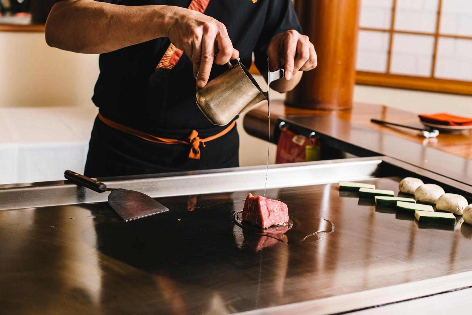 Intercontinental Adelaide By Ihg Otel Dış mekan fotoğraf A sushi chef seasoning a piece of tuna
